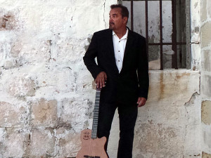 Dean Grech Spanish Guitar guitarist entertains at coporate events, weddings, concerts, book at www.wendoevents.com